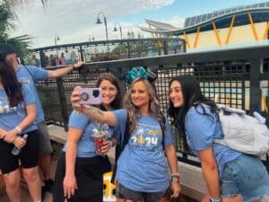 Bright group of women taking a selfie at 407&Beyond, enjoying team-building and work at Orlando theme park.